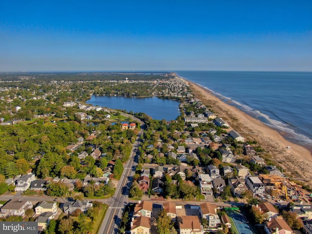 drone / aerial view featuring a view of the beach and a water view