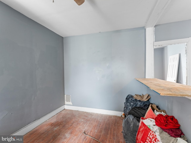 interior space featuring ceiling fan and dark wood-type flooring