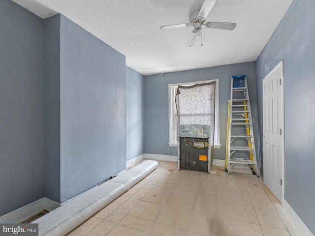 interior space featuring ceiling fan and light tile flooring