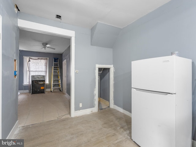 kitchen with ceiling fan and white refrigerator