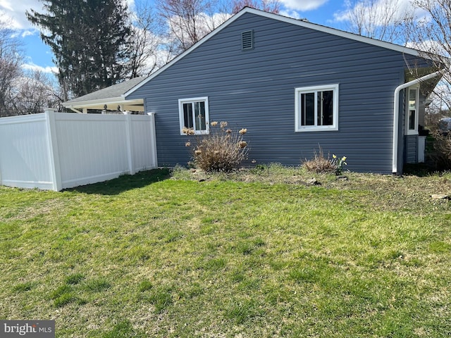 view of property exterior featuring a yard