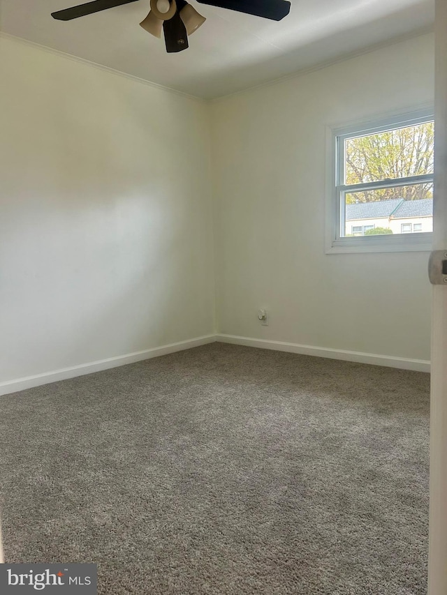 empty room featuring carpet and ceiling fan