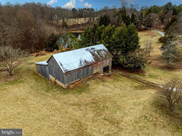 birds eye view of property with a rural view and a water view