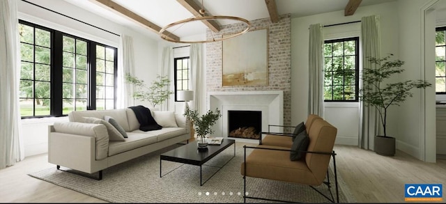 sitting room featuring plenty of natural light, light wood-type flooring, and beam ceiling