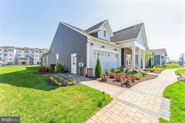 view of front of house with a front lawn and a garage