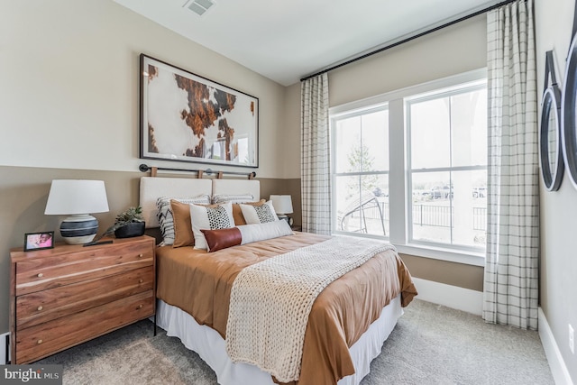 bedroom featuring light colored carpet