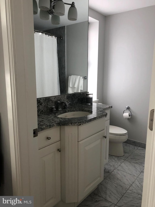 bathroom with vanity and toilet