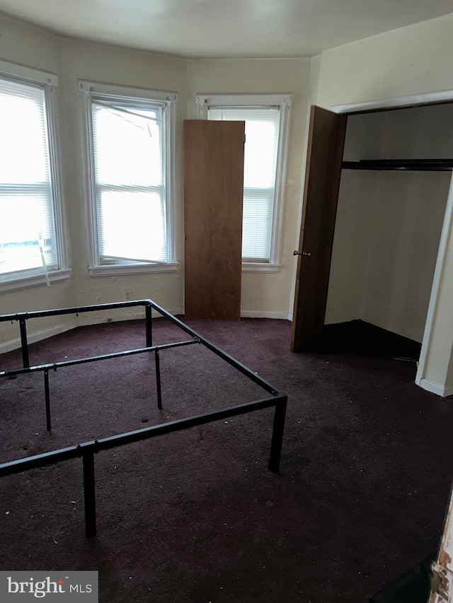 unfurnished bedroom with carpet