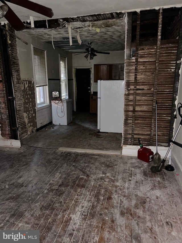 interior space with dark hardwood / wood-style floors and ceiling fan