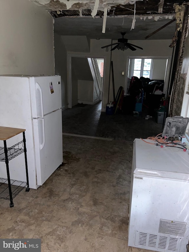 kitchen featuring ceiling fan and white refrigerator