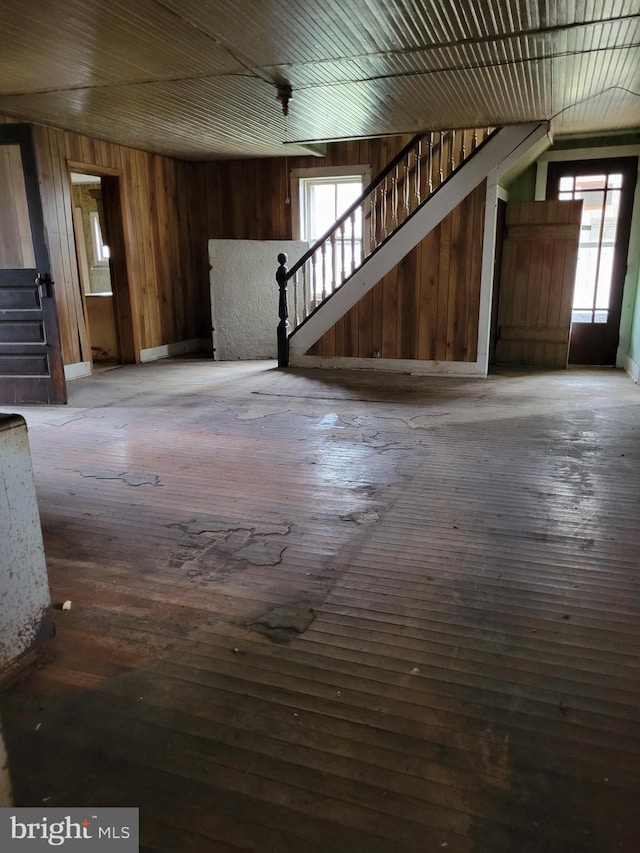 interior space featuring dark wood-type flooring and a wealth of natural light