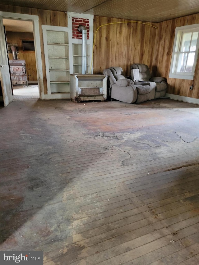 interior space featuring wooden walls and light hardwood / wood-style floors