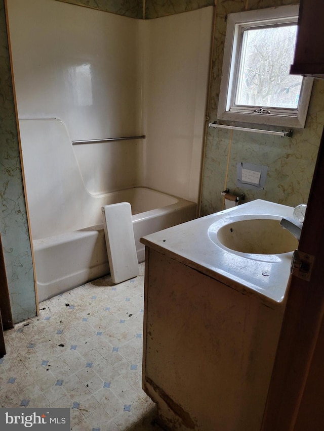 bathroom with shower / bathtub combination, tile flooring, and vanity