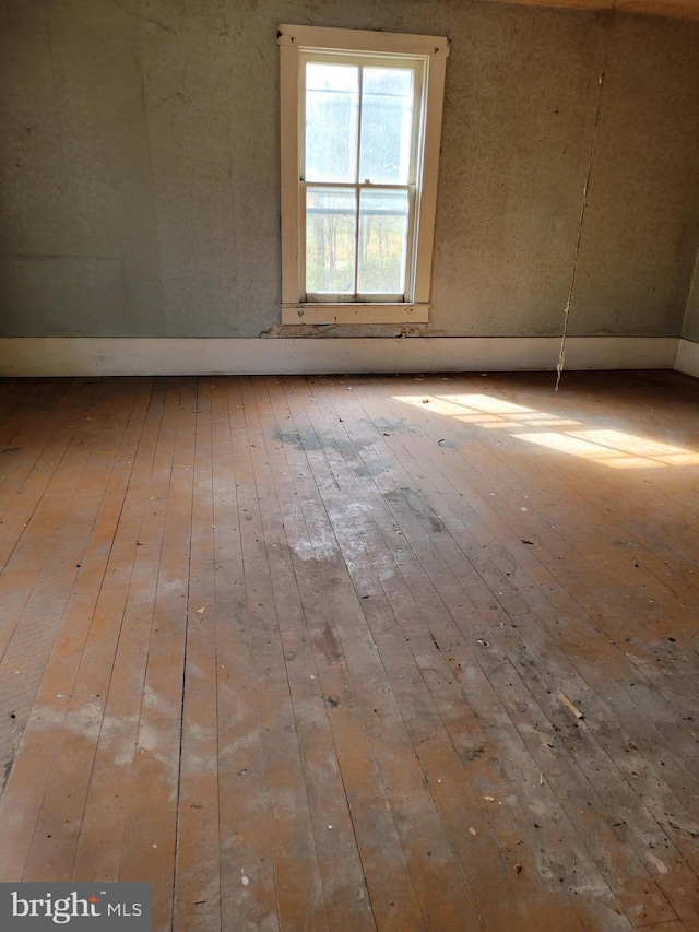 unfurnished room featuring wood-type flooring