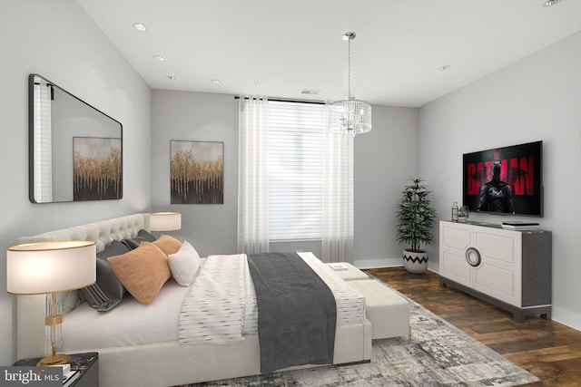 bedroom featuring a notable chandelier and dark wood-type flooring