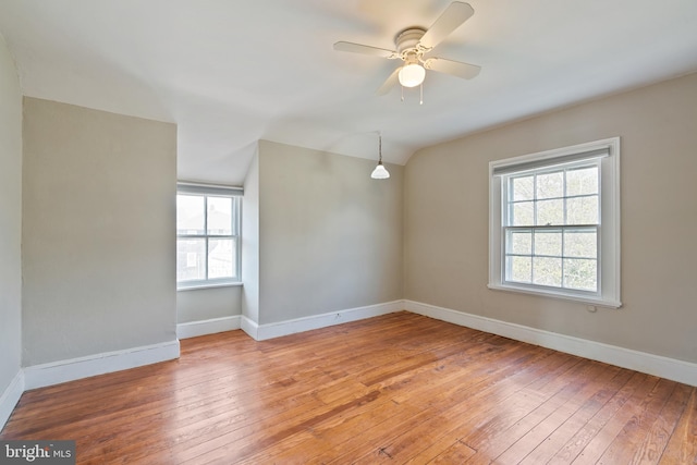 spare room with light hardwood / wood-style flooring and ceiling fan