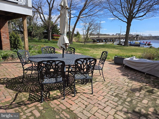 view of patio with a water view