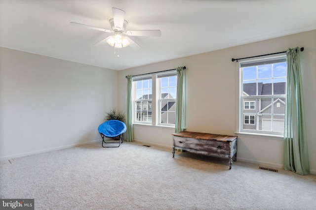 unfurnished room with light carpet and ceiling fan