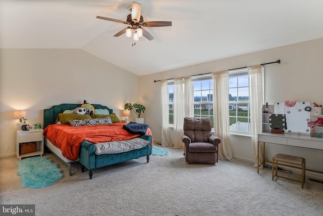 bedroom featuring light colored carpet, ceiling fan, and vaulted ceiling