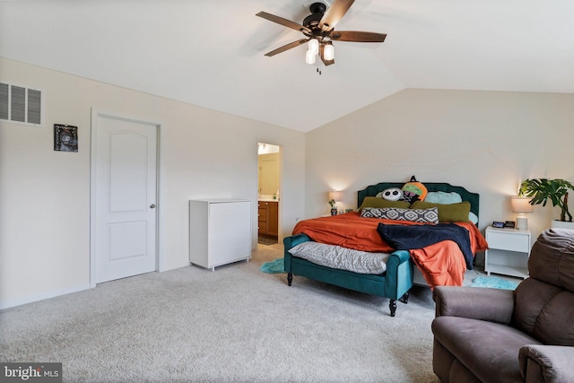 carpeted bedroom featuring lofted ceiling, ceiling fan, and ensuite bathroom