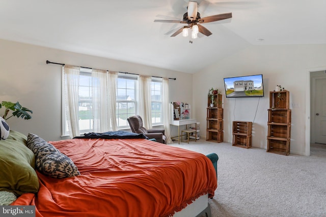 bedroom featuring light colored carpet, lofted ceiling, and ceiling fan