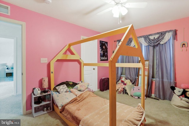 carpeted bedroom featuring ceiling fan