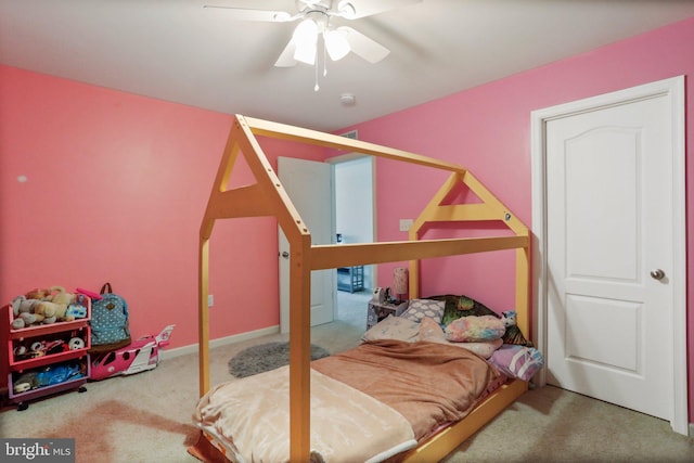 bedroom featuring ceiling fan and light carpet