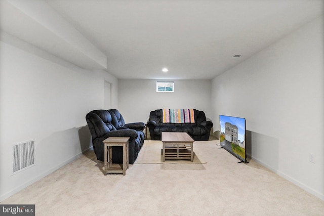 living area featuring light colored carpet