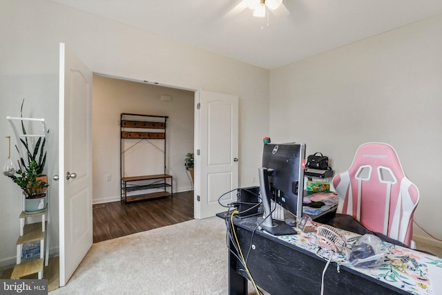 carpeted office with ceiling fan