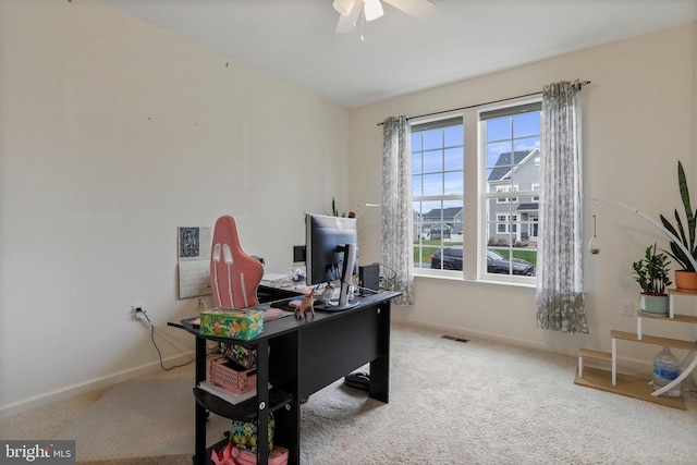 office with light carpet and ceiling fan