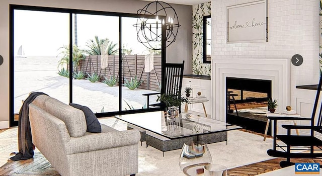 living room featuring brick wall, an inviting chandelier, and a fireplace