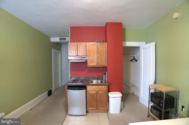 kitchen featuring light carpet, dishwasher, black electric cooktop, and sink