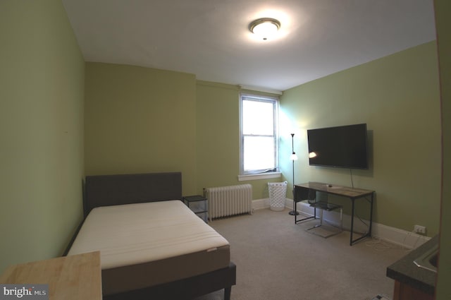 carpeted bedroom featuring radiator heating unit