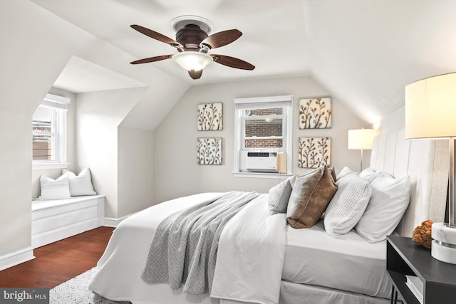 bedroom with dark hardwood / wood-style flooring, ceiling fan, and vaulted ceiling