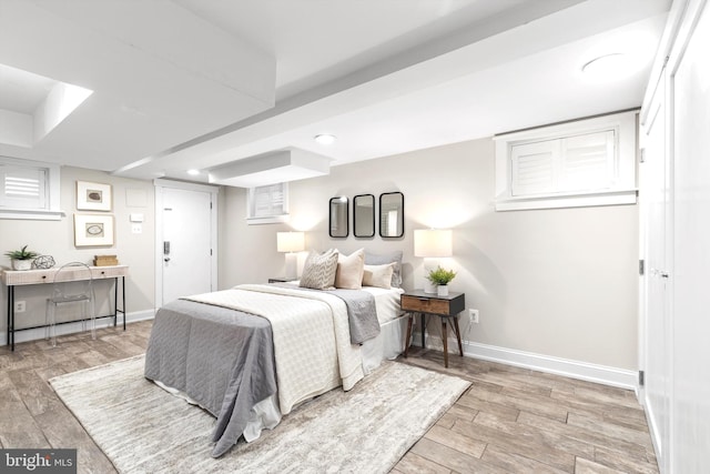 bedroom with hardwood / wood-style flooring