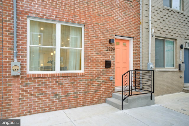 doorway to property with a patio area