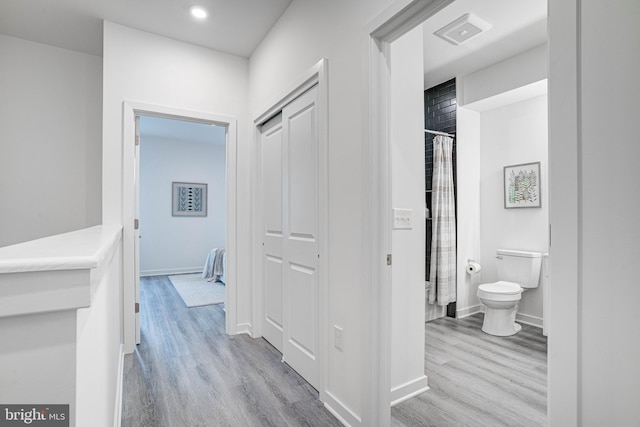 corridor featuring light hardwood / wood-style flooring