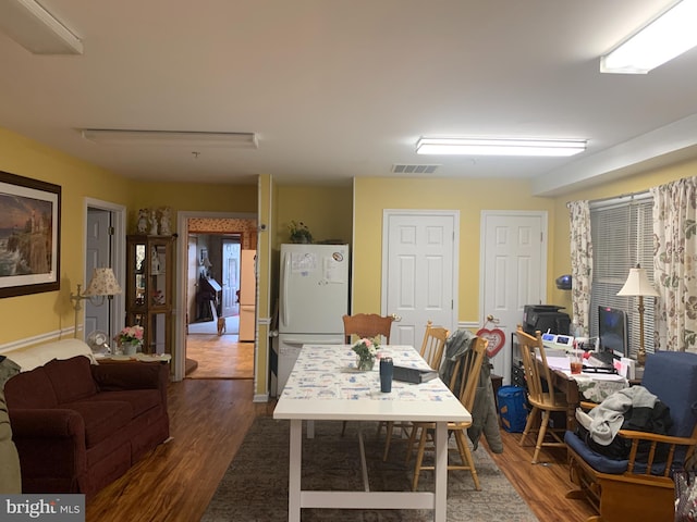 office area featuring dark wood-type flooring