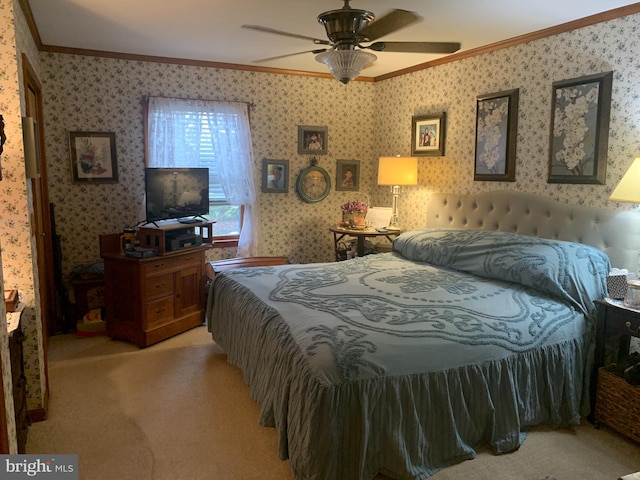 carpeted bedroom with ornamental molding and ceiling fan