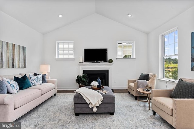 living room with vaulted ceiling and light wood-type flooring