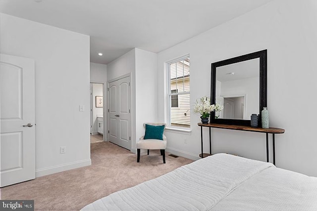 bedroom with light colored carpet