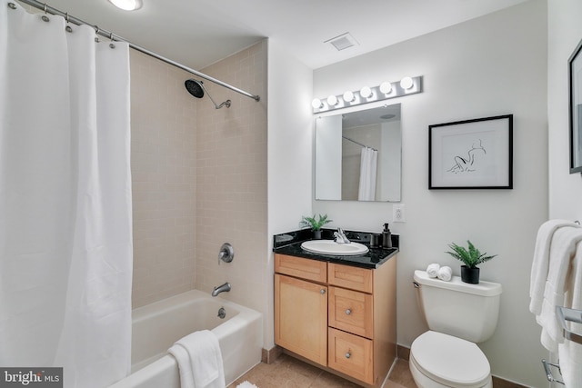 full bathroom with toilet, shower / tub combo, vanity, and tile flooring