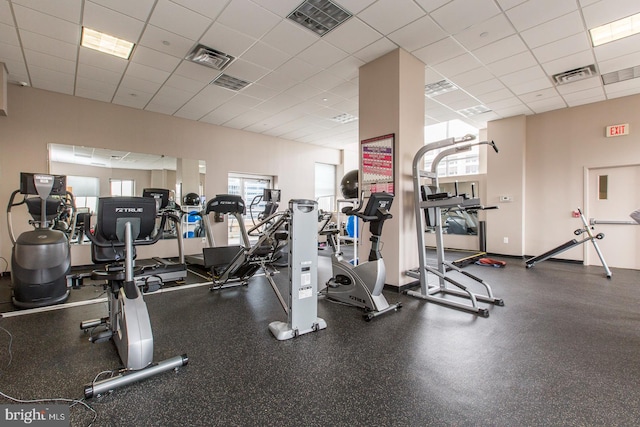 workout area featuring a drop ceiling