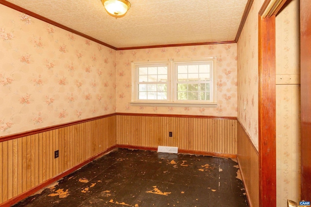 spare room featuring ornamental molding