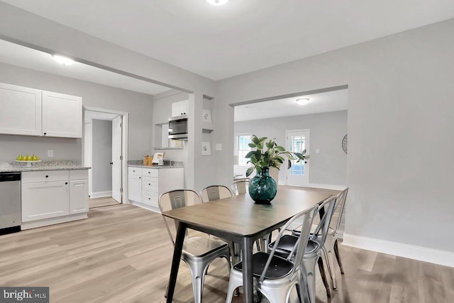 dining room with light wood-type flooring