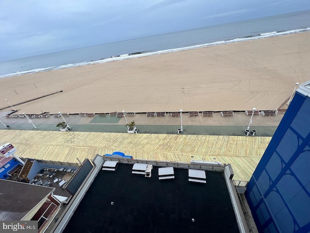 birds eye view of property with a view of the beach and a water view