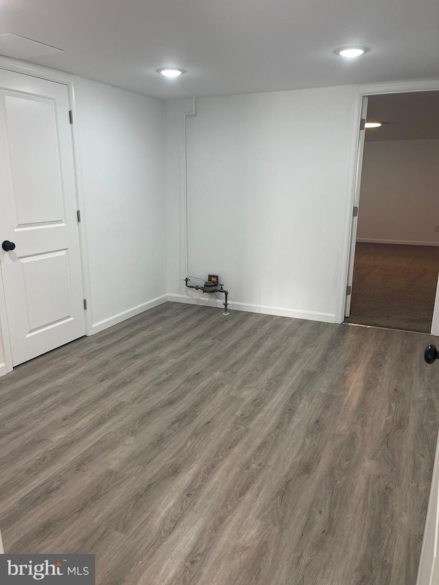 basement featuring dark hardwood / wood-style flooring