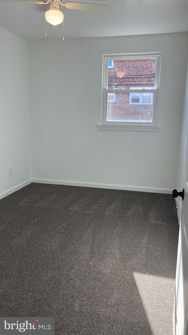 carpeted empty room with ceiling fan