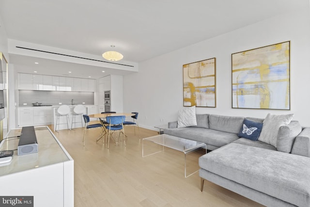 living room with light hardwood / wood-style floors