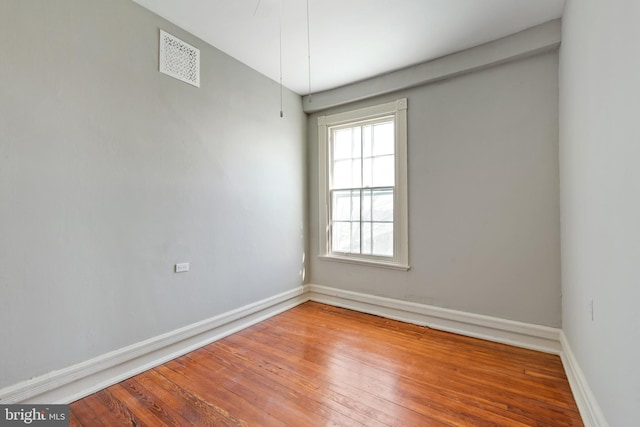 empty room featuring hardwood / wood-style flooring